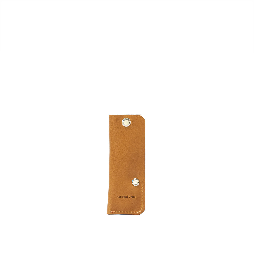 a brown leather rectangular object with rhinestones