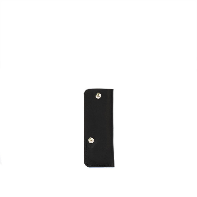 a black leather case with silver rivets