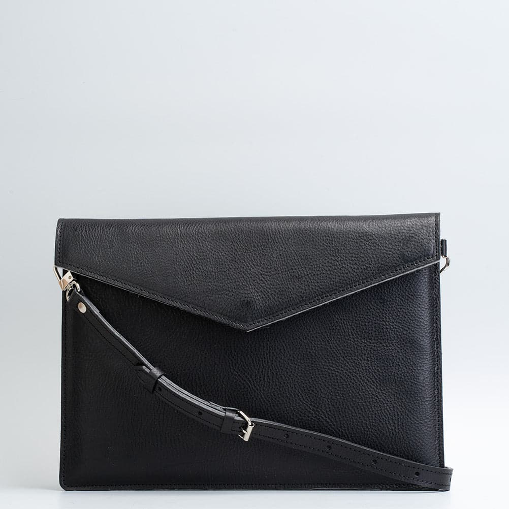 a black leather bag with a strap