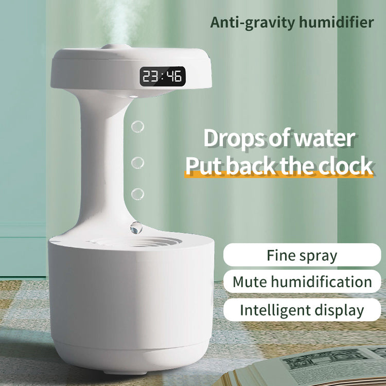 a white device with a digital clock and water droplets