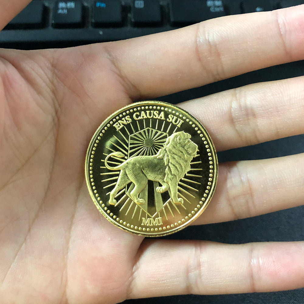 a hand holding a gold coin