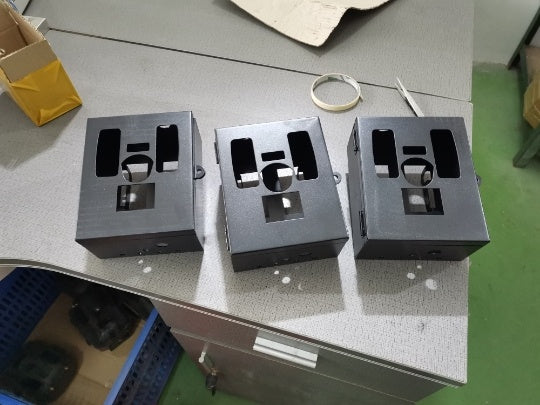 a group of metal boxes on a table