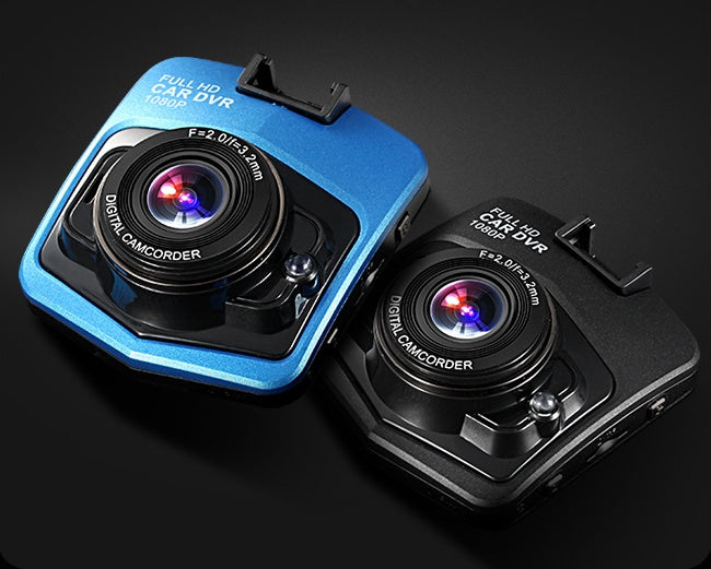 a pair of cameras on a black surface