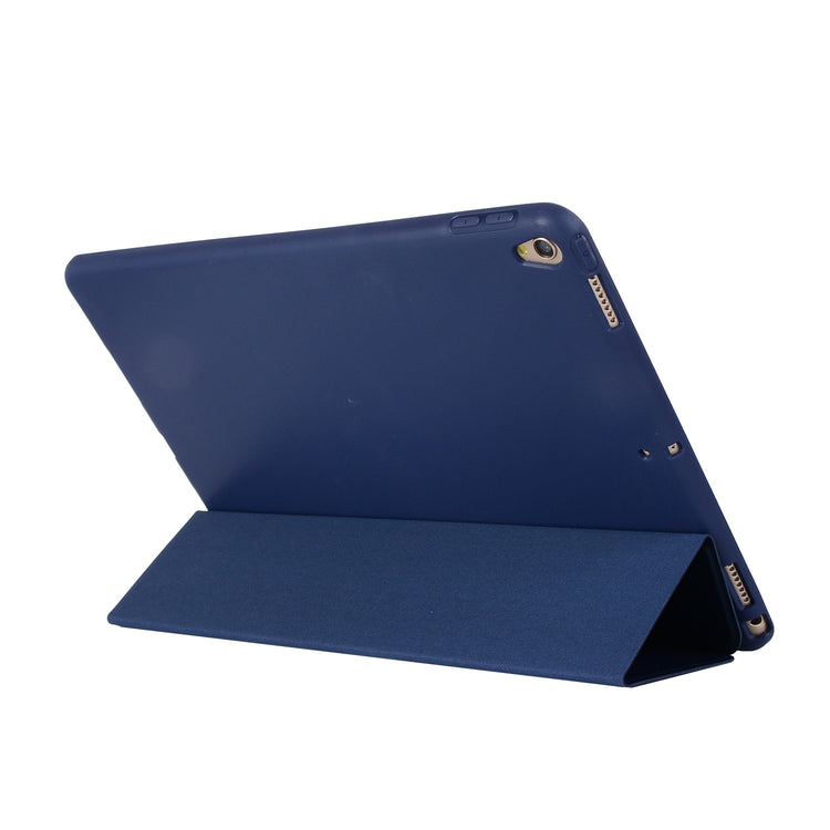 a blue tablet with a stand