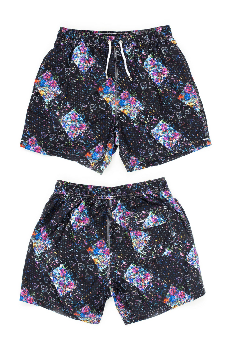 a pair of black shorts with colorful designs