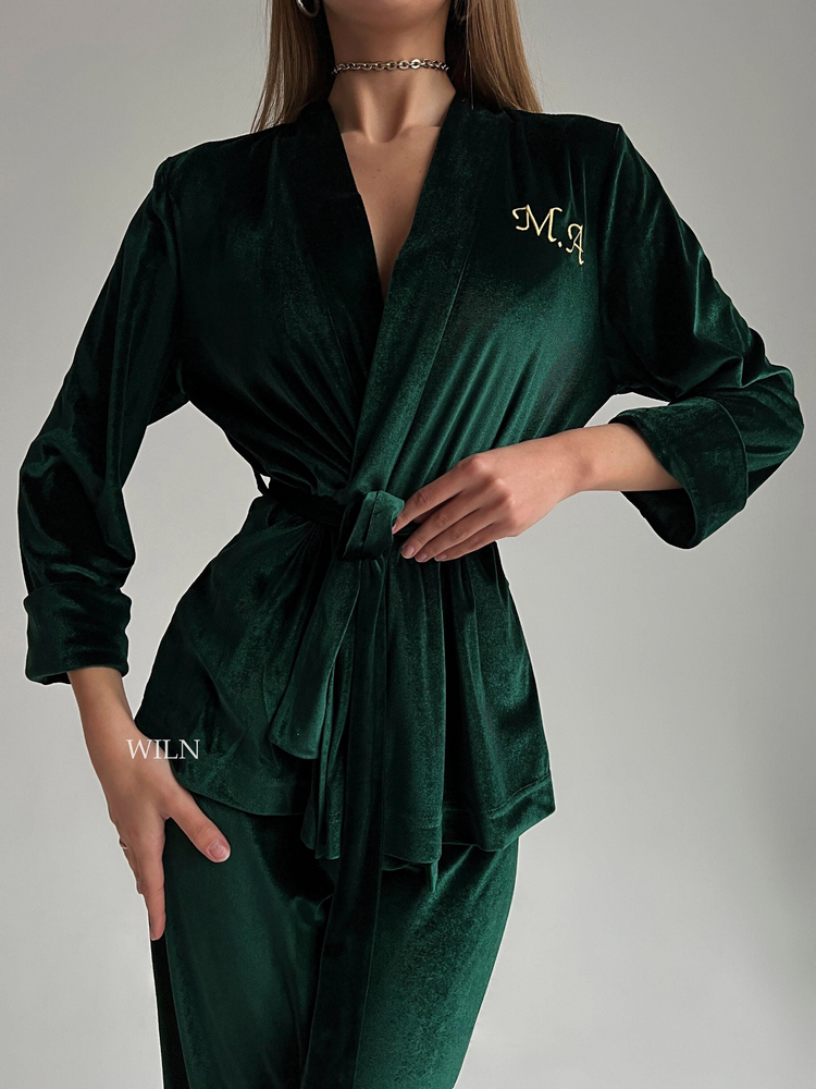 a woman wearing a green robe