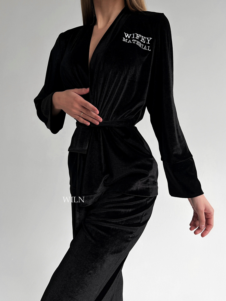 a woman in a black robe