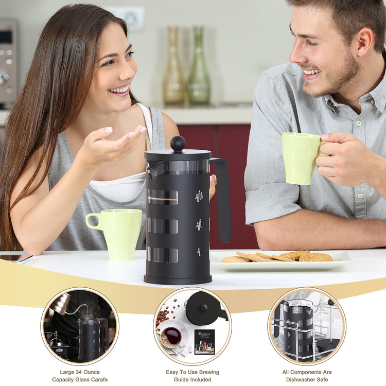 a man and woman sitting at a table with coffee cups and cookies