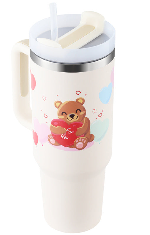 a white mug with a bear and hearts on it