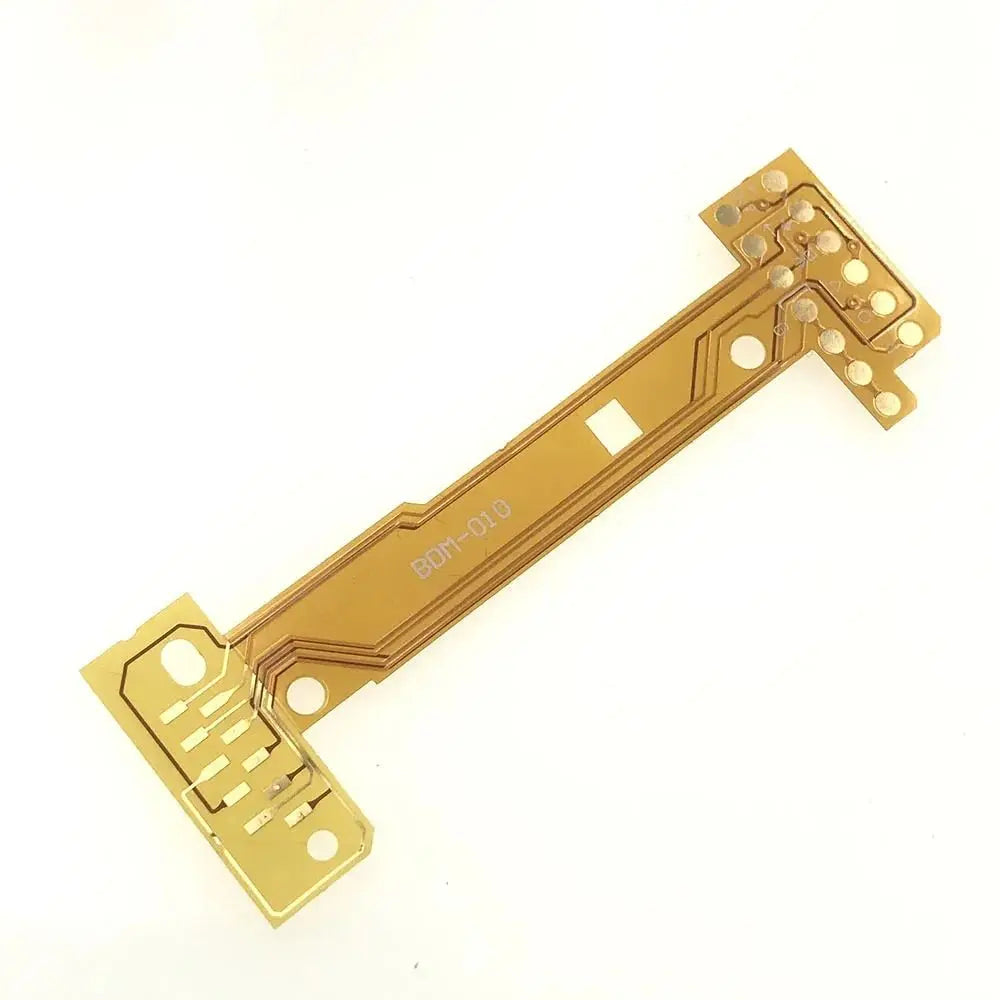 a gold circuit board with many small holes