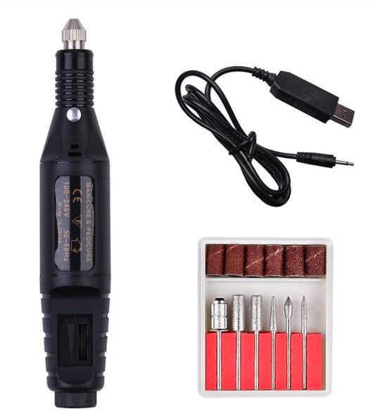 a black electric drill and a box of bits