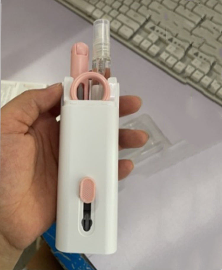 a hand holding a device