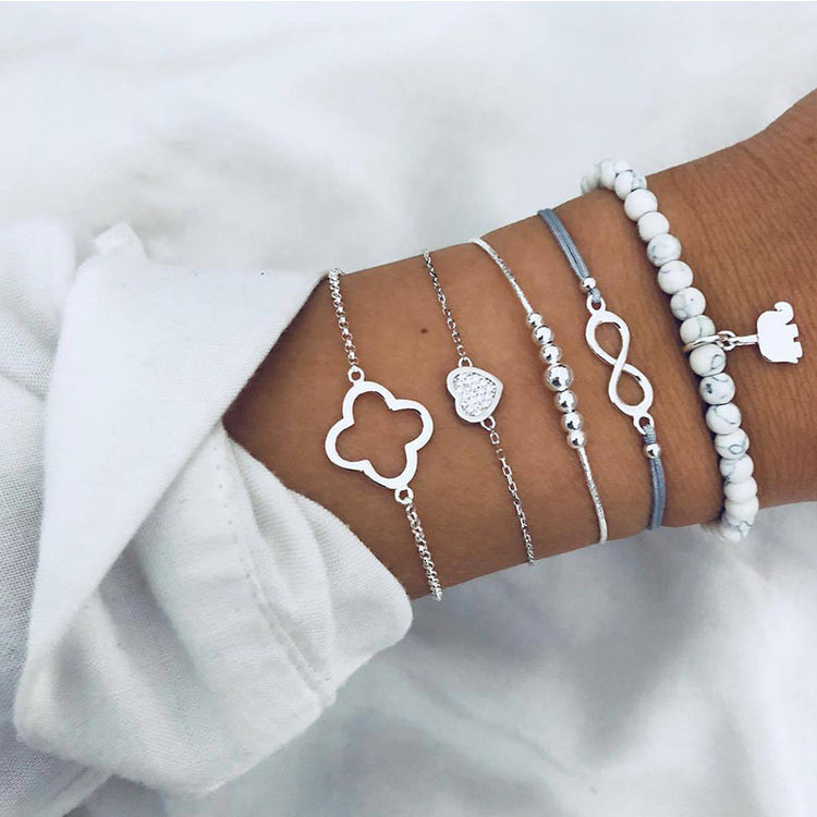 a person's wrist with bracelets