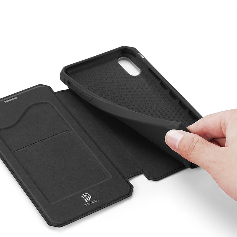 a hand holding a phone case