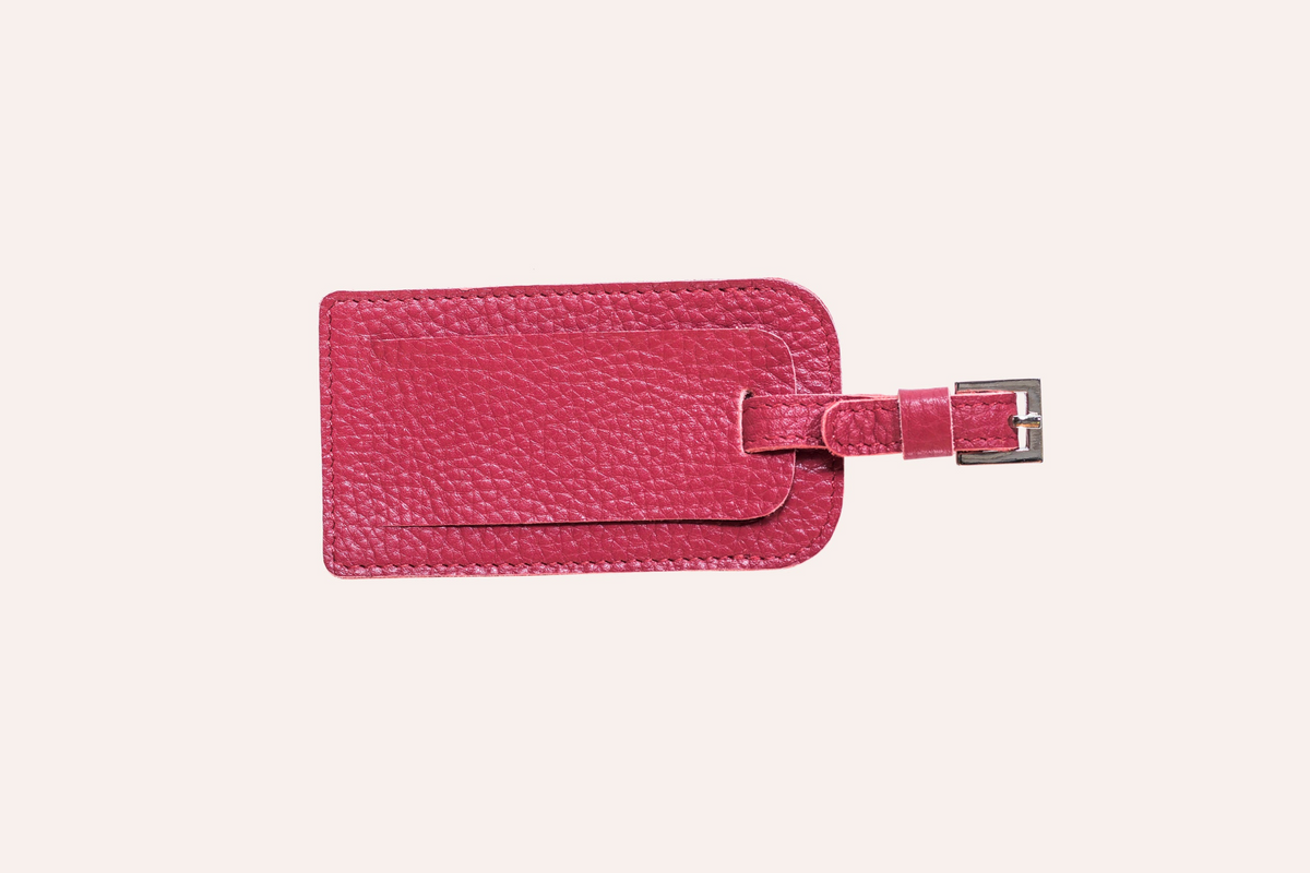 a pink leather luggage tag