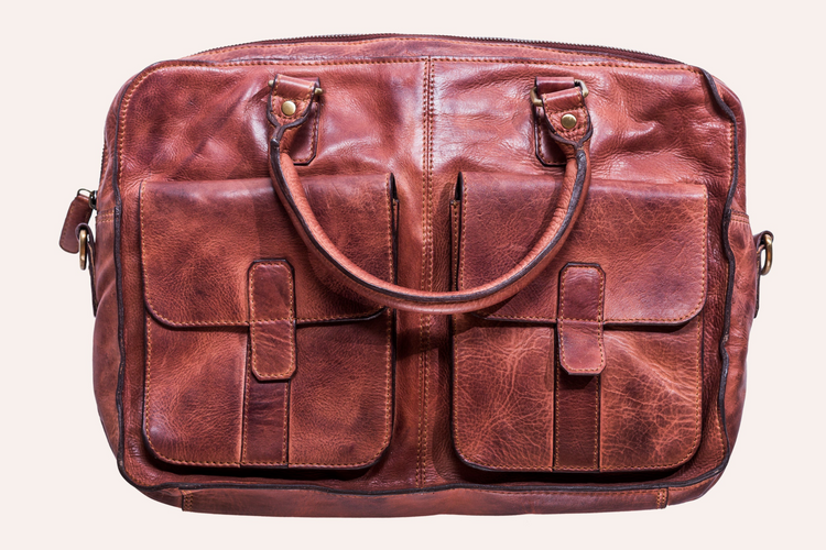 a brown leather bag with a handle
