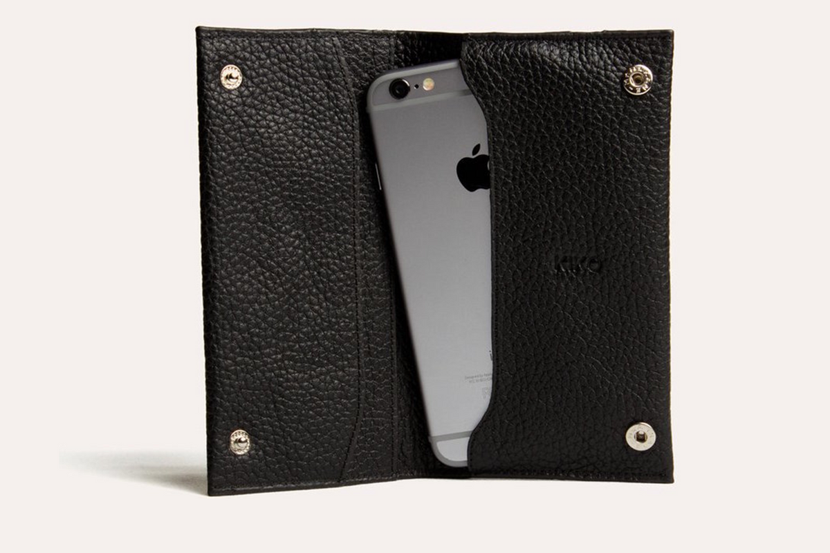a cell phone in a black leather case