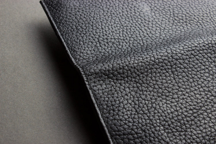 a close up of a black leather