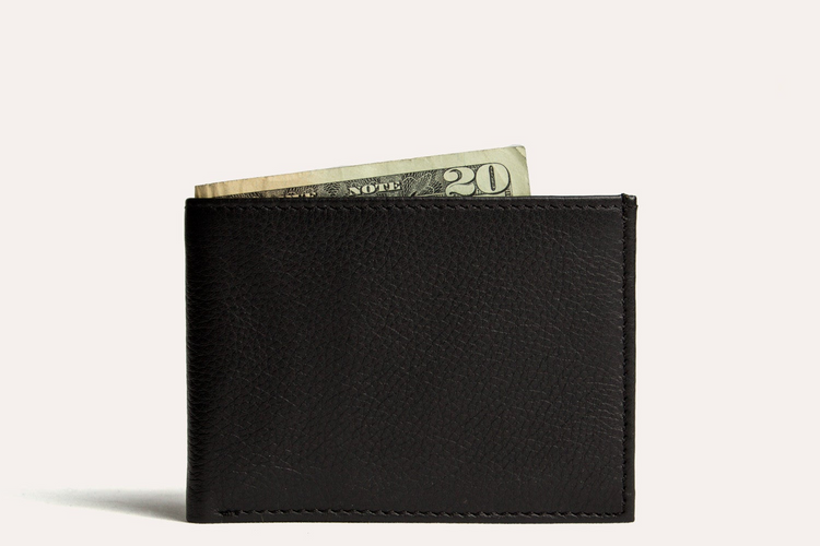 a black wallet with a paper money in it