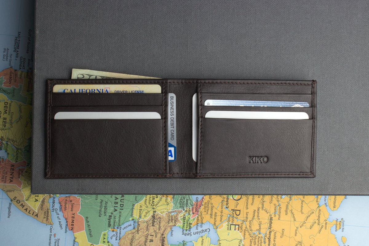 a wallet with money and cards on it