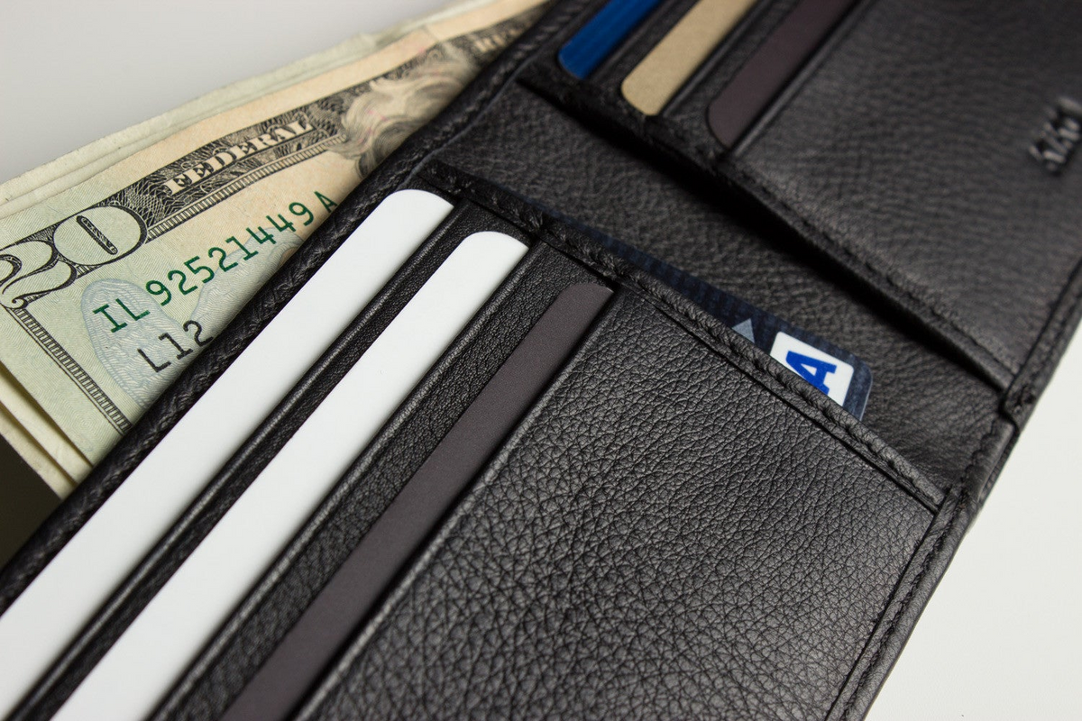 a wallet with money and credit cards
