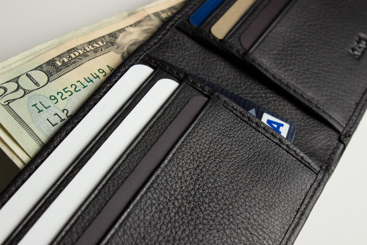 a wallet with money and credit cards