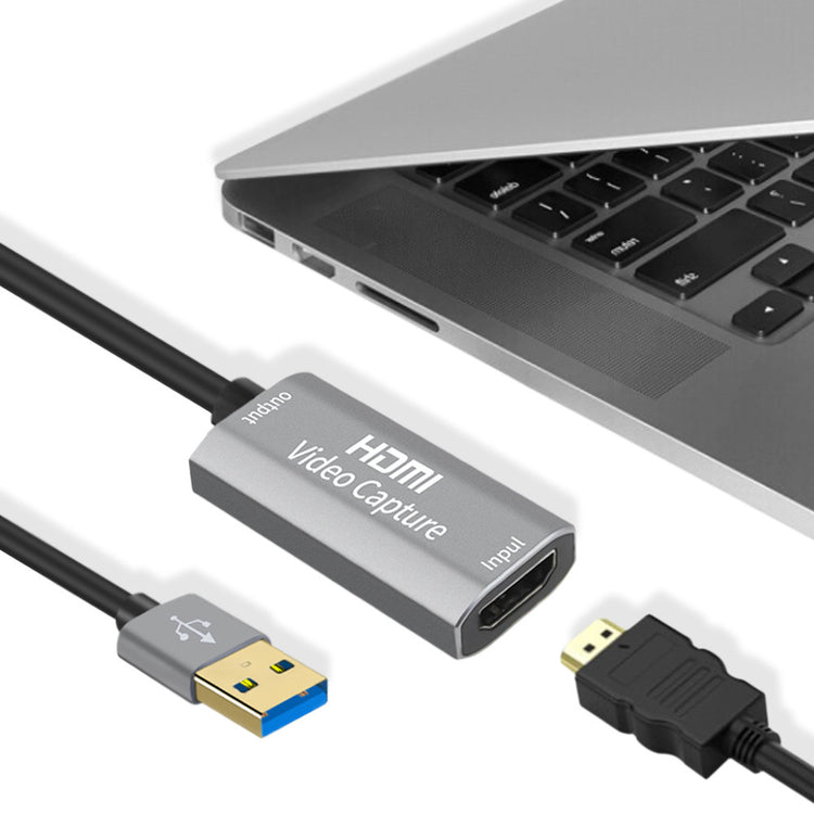 a laptop with a video capture cable