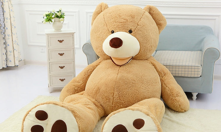 a large teddy bear sitting on a rug