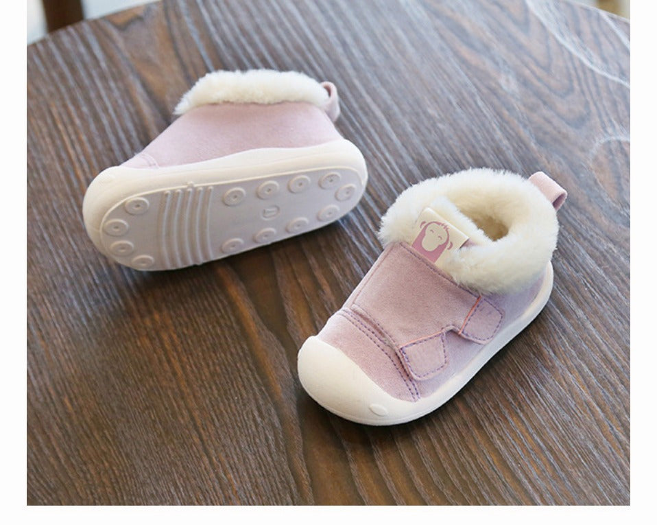 a pair of pink baby shoes