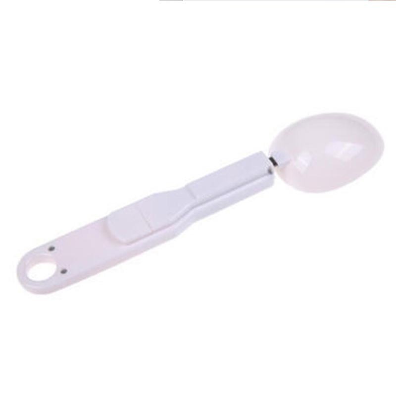 a white plastic spoon with a round handle