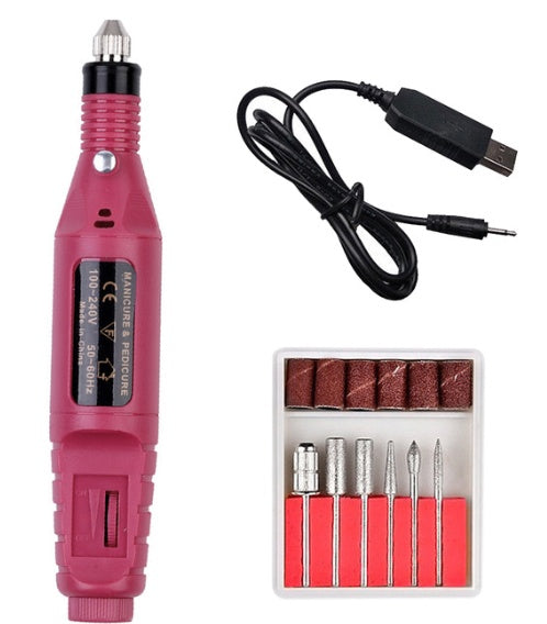 a pink nail drill and a box of bits