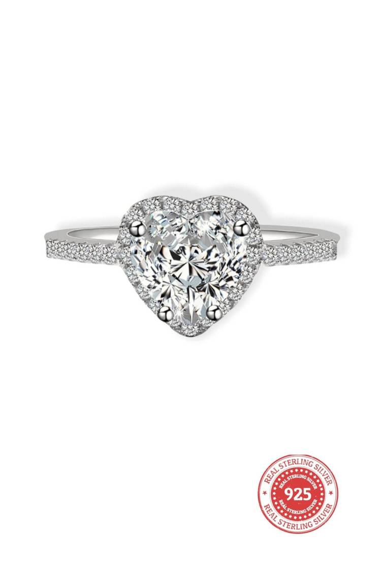 a diamond ring with a heart shaped stone