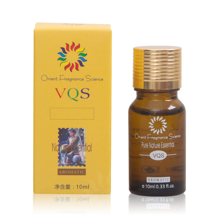 a small bottle of essential oil next to a box