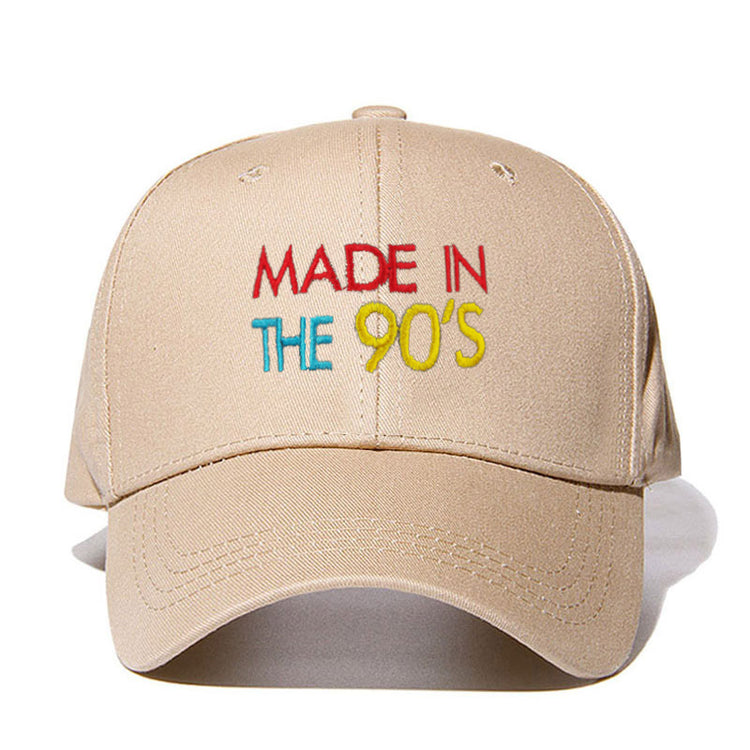 a tan hat with colorful text on it