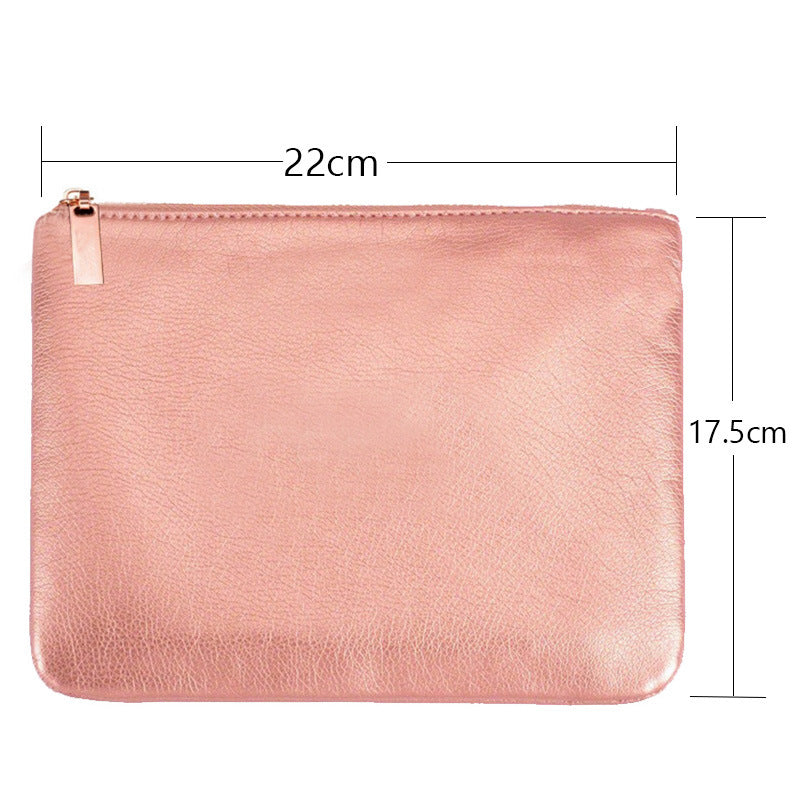 a pink leather pouch with size of a zipper