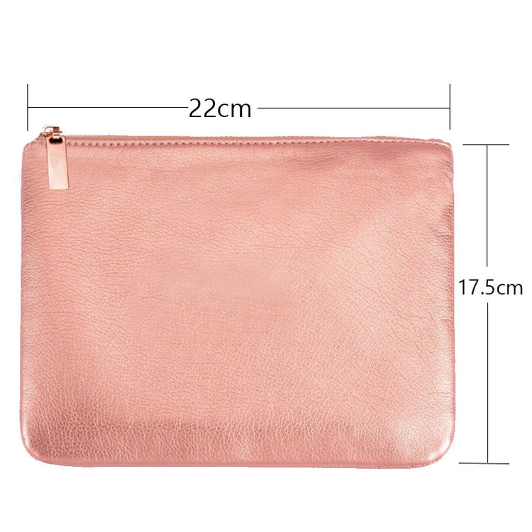 a pink leather pouch with size of a zipper