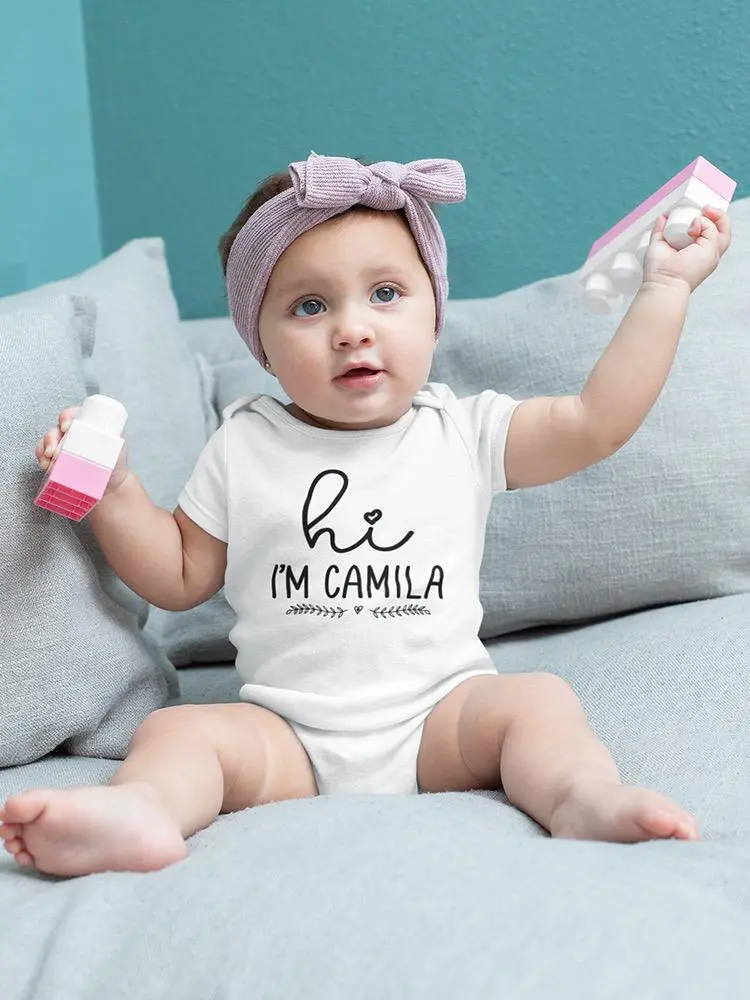 a baby holding a toy