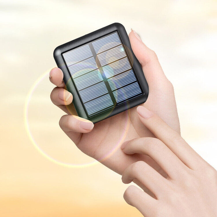 a hand holding a solar panel