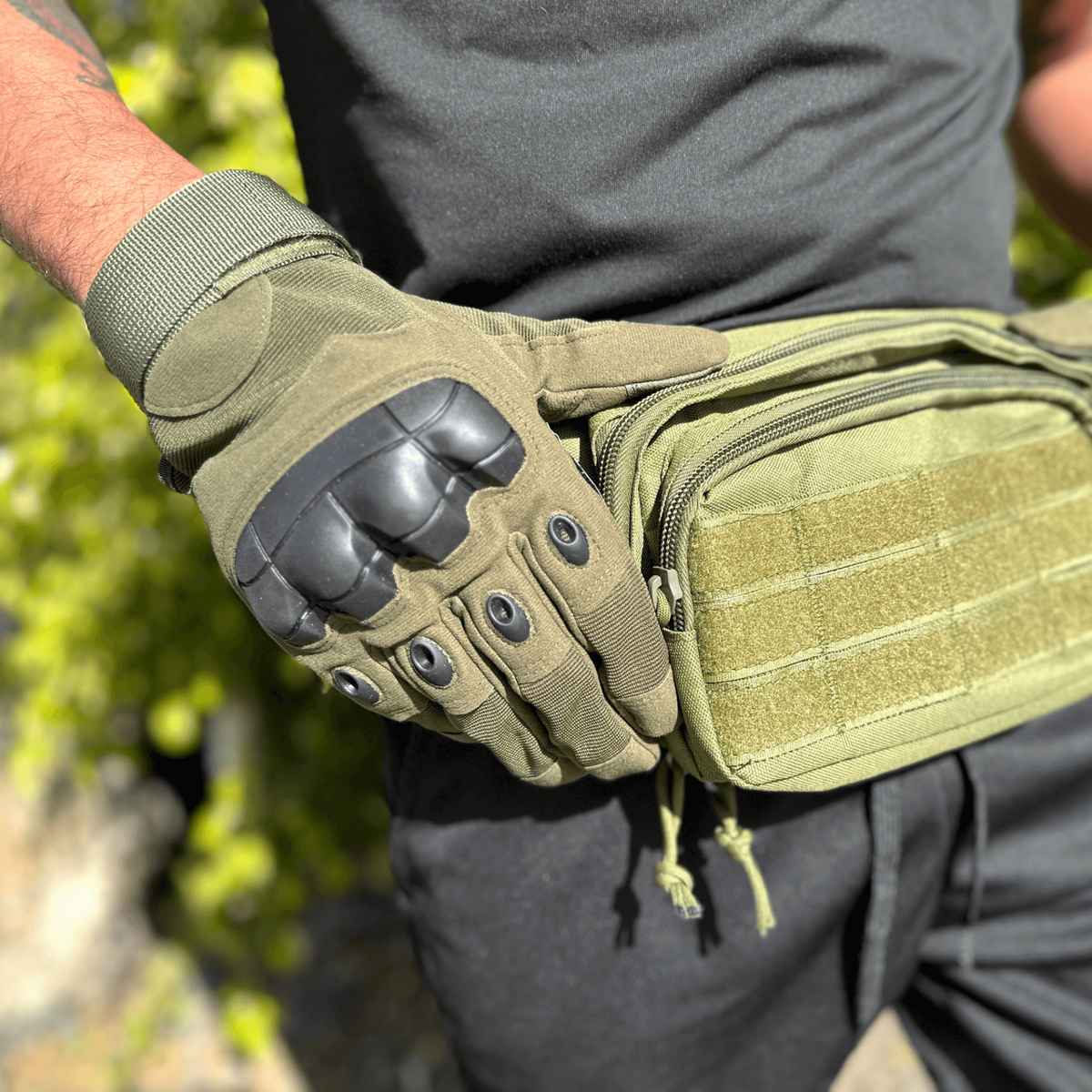 a person wearing gloves and a waist bag
