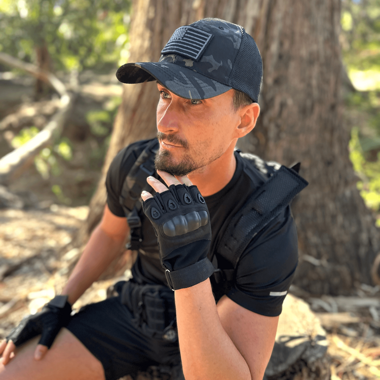 a man wearing a black hat and gloves