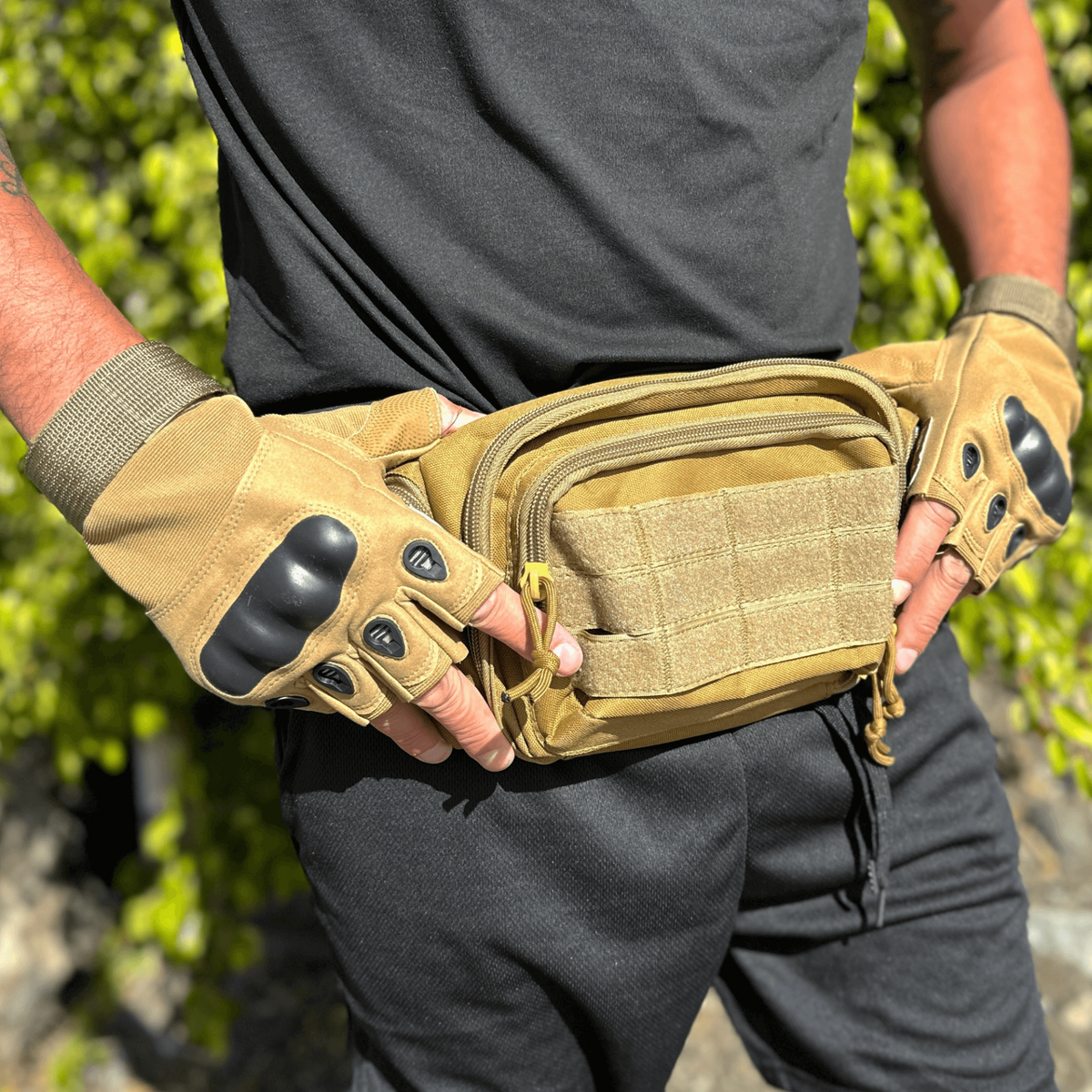 a man wearing gloves and a tan belt