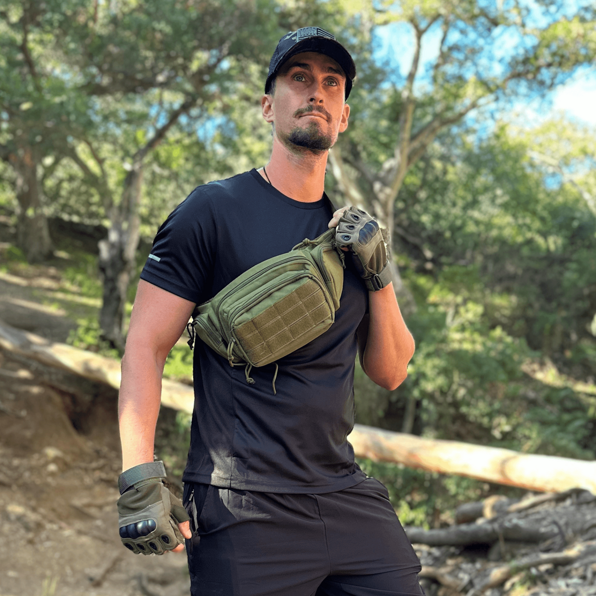 a man wearing a black shirt and gloves