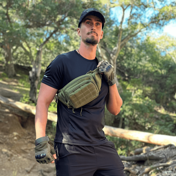 a man wearing a black shirt and gloves