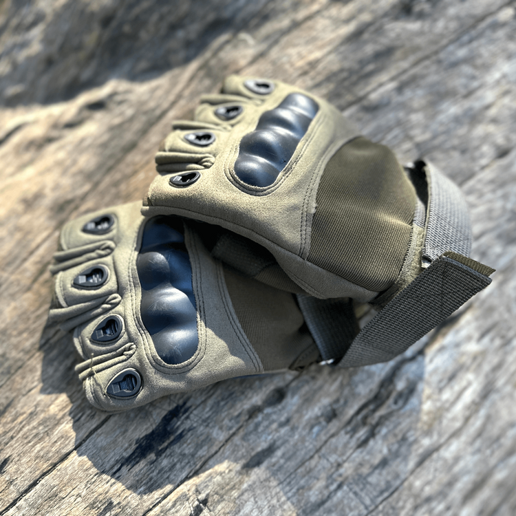 a pair of gloves on a wood surface