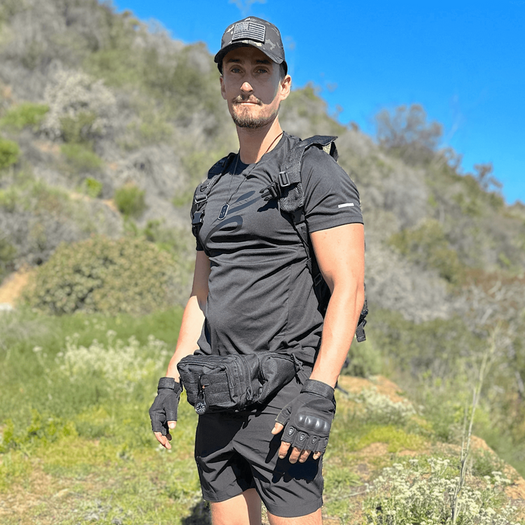 a man in a black shirt and shorts
