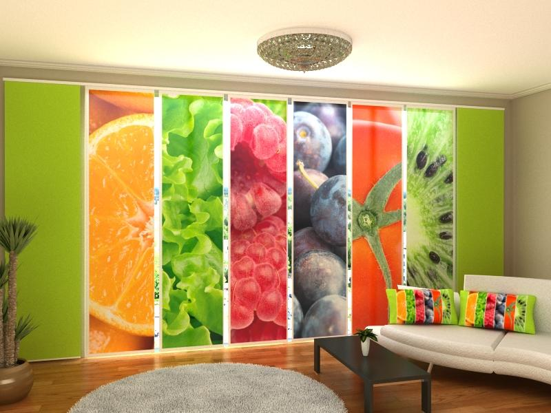 a room with a couch and a wall of fruit