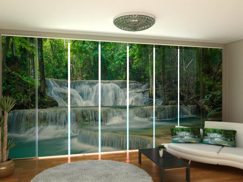 a room with a waterfall and a couch