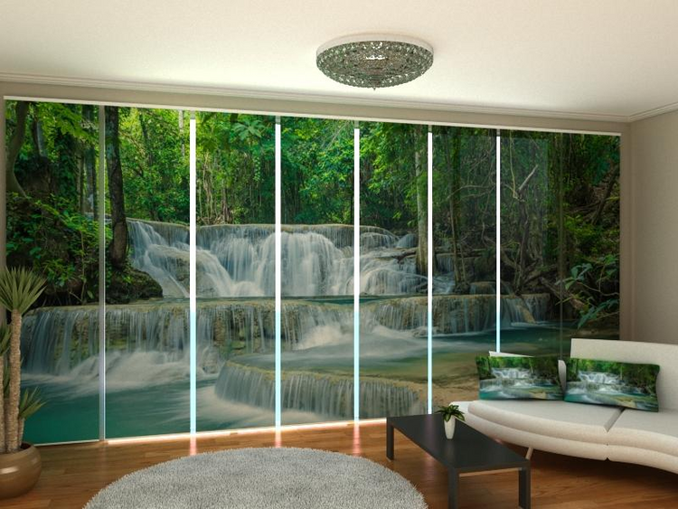 a room with a waterfall and a couch