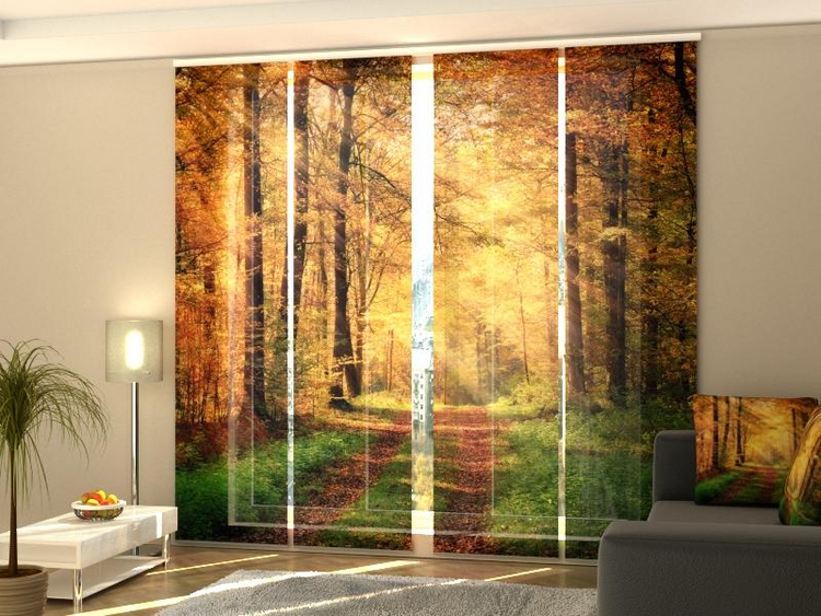 a room with a window with trees and a couch