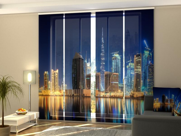 a room with a large window with a city view